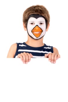 Boy with animal face-paint behind a white board