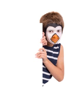 Boy with animal face-paint over a white board isolated in white