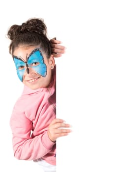 Girl with animal face-paint behind a white board