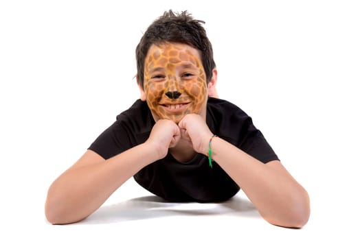 Boy with animal face-paint behind a white board