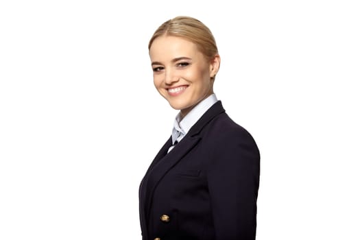 Friendly smiling young business woman in a dark business suit isolated on white background.