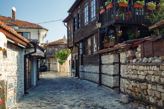 Nesebar, Bulgaria - September 10, 2014: Old town of Nessebar at Black Sea, Bulgaria. Street, ancient architecture and cobbled stone pavement. UNESCO world heritage site.
