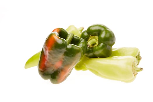Fresh ripe peppers on white background.