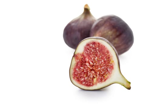 Fresh ripe sweet figs on a white background.