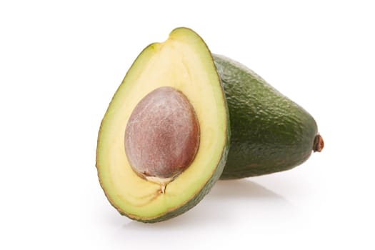 Fresh avocado fruits on a white background.