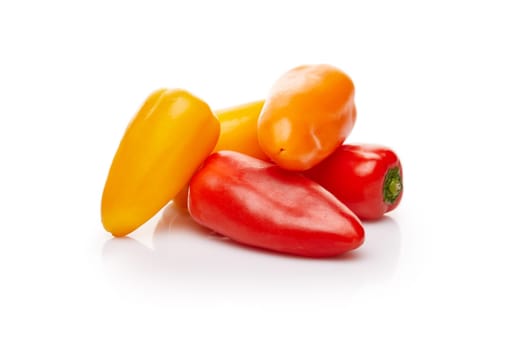 Fresh ripe peppers on white background.
