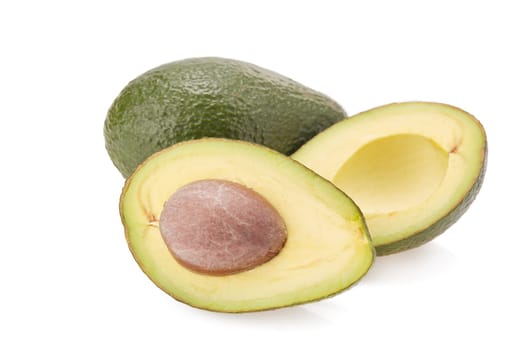 Fresh avocado fruits on a white background.