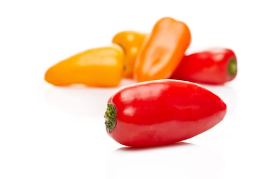 Fresh ripe peppers on white background.