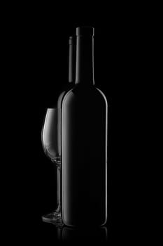 Silhouette of two wine bottles and empty wineglass on a black background with reflection. Contour with gradient and highlights