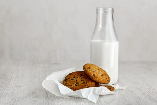 Oatmeal Raisin CookiesOatmeal cookies with raisins and a bottle of milk