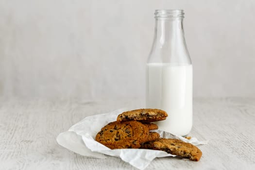 Oatmeal Raisin CookiesOatmeal cookies with raisins and a bottle of milk