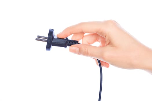 Woman hand holding black male wire plug isolated on white background