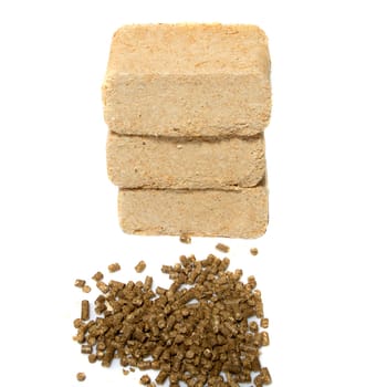 sawdust briquettes and pellets on white background