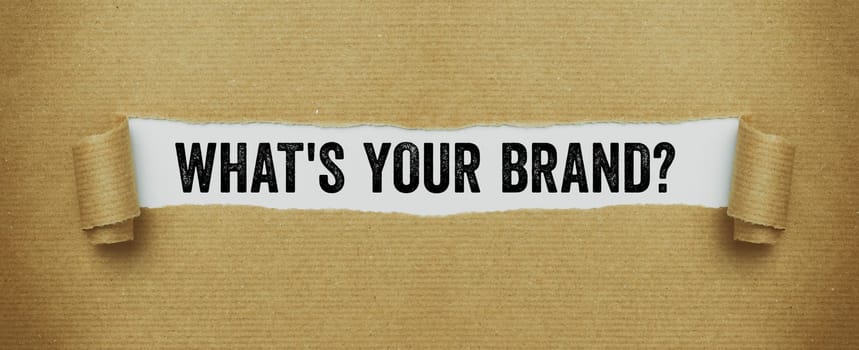 Torn brown paper revealing the words What is your brand