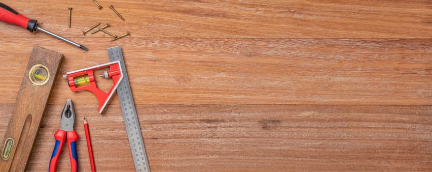 Tools on a wooden background with copy space