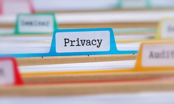 File folders with a tab labeled Privacy