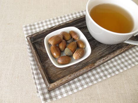 Acorn coffee from roasted acorns on a tray