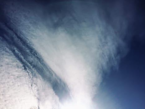 dramatic blue sky with clouds and sun rays background