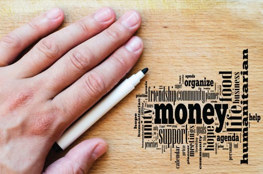 Money word cloud business concept over wooden background.