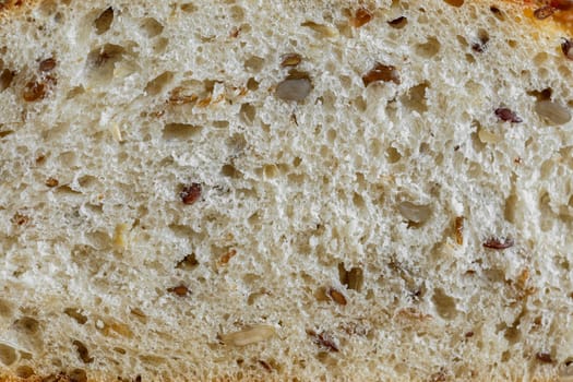 Bread with different seeds in the cut close-up