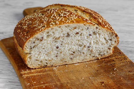 Bread with sunflower seed cutting board, slice on bread