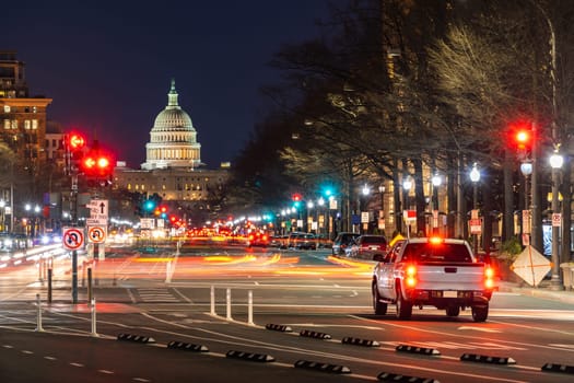 US Capitol Building at sunset along street in Washington, DC, USA