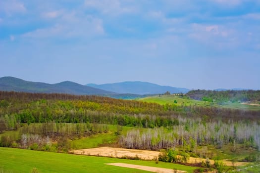 Carpathian mountains range under cloudy sky in Romania