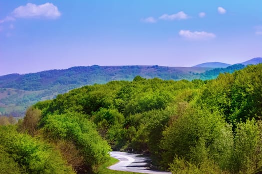 Carpathian mountains under blue sky in Romania