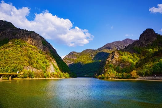 Carpathian mountains under blue sky in Romania