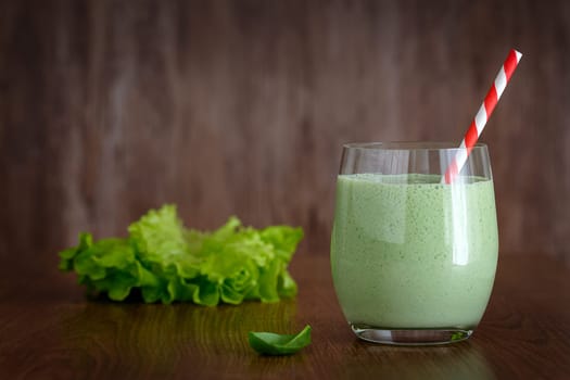 Greek yogurt smoothies with herbs on a dark background