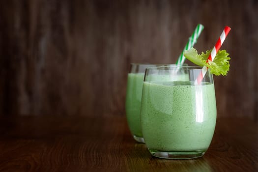 Greek yogurt smoothies with herbs on a dark background