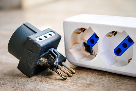 A burnt power strip melted plastic for electrocution danger .