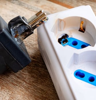 A burnt power strip electrocution danger vertical .
