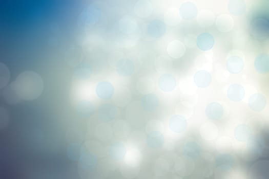 Abstract festive light blue silver bokeh background texture with colorful circles and bokeh lights. Beautiful backdrop with space.