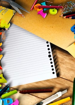 School supplies and stationery with white paper on wooden table with copyspace. Back to School concept
