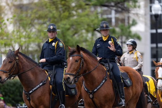 Wilmington, North Carolina, USA - April 6, 2019: The North Carolina.Azalea Festival, Police officers riding horses during the parade