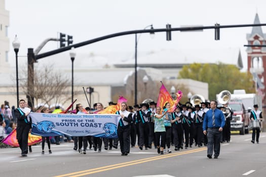 Wilmington, North Carolina, USA - April 6, 2019: The North Carolina.Azalea Festival, Members of the South Brunswick High School pride Of The Swouth Coast, performing at the parade