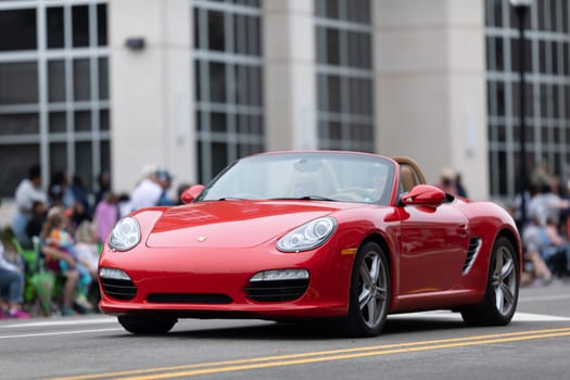Wilmington, North Carolina, USA - April 6, 2019: The North Carolina.Azalea Festival, Porsche Sport car driving down the street at the parade