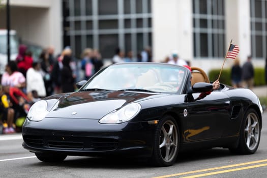 Wilmington, North Carolina, USA - April 6, 2019: The North Carolina.Azalea Festival, Porsche Sport car driving down the street at the parade