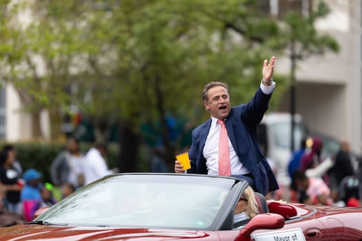 Wilmington, North Carolina, USA - April 6, 2019: The North Carolina.Azalea Festival, Bill Saffo, Wilmington Mayor riding on a car at the parade