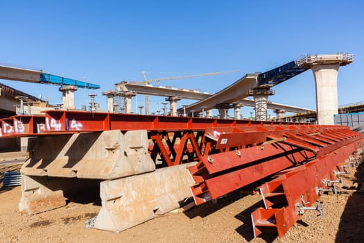 New Road highway expansion construction industrial building of overhead ramps concrete columns to traffic vehicle junction.