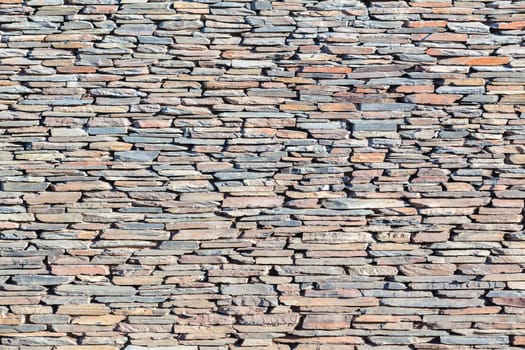 Slate stone wall closeup  photo of material texture background detail.
