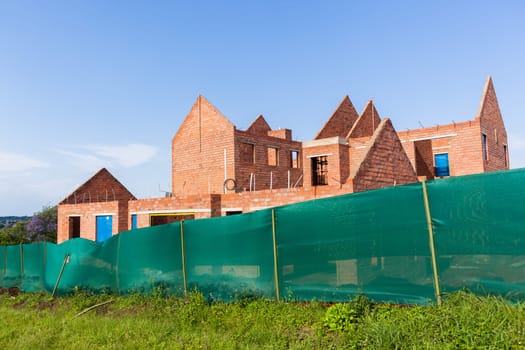 Building construction artisan hands tool laying bricks closeup cement wire wall construction