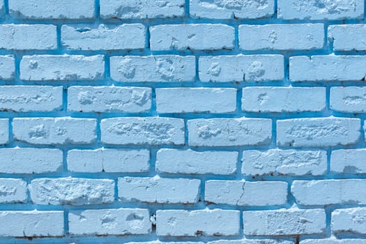 Brick wall painted blue outside decor texture detail color closeup background building structure..