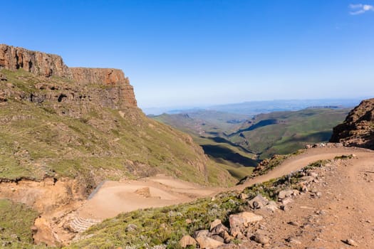 Mountain high dirt road pass from river valley up or down by four wheel vehicle  summer landscape