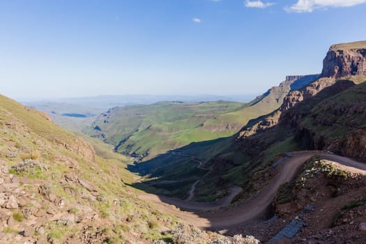 Mountain high dirt road pass from river valley up or down by four wheel vehicle  summer landscape