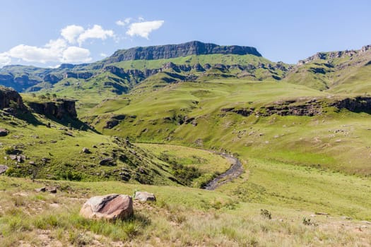 Mountains valley river rocky cliffs rural countryside scenic summer landscape.