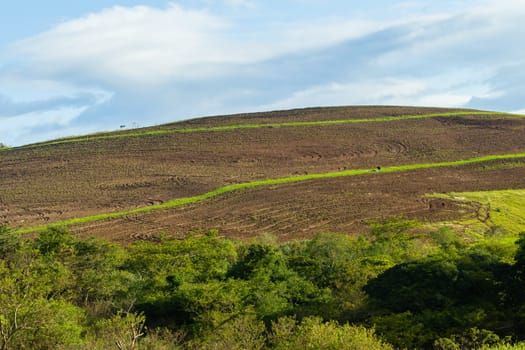 Mountains rural valley hills farming crops terrain scenic summer landscapes..