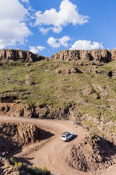 Mountain high dirt road pass from river valley up or down by four wheel vehicle  summer landscape