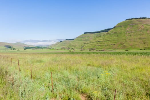 Mountains rural valley hills farming crops terrain scenic summer landscapes..